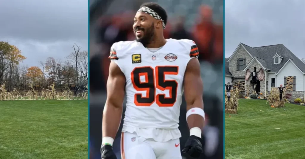 Front view of Myles Garrett’s modern home with big windows, palm trees, and a neat lawn.