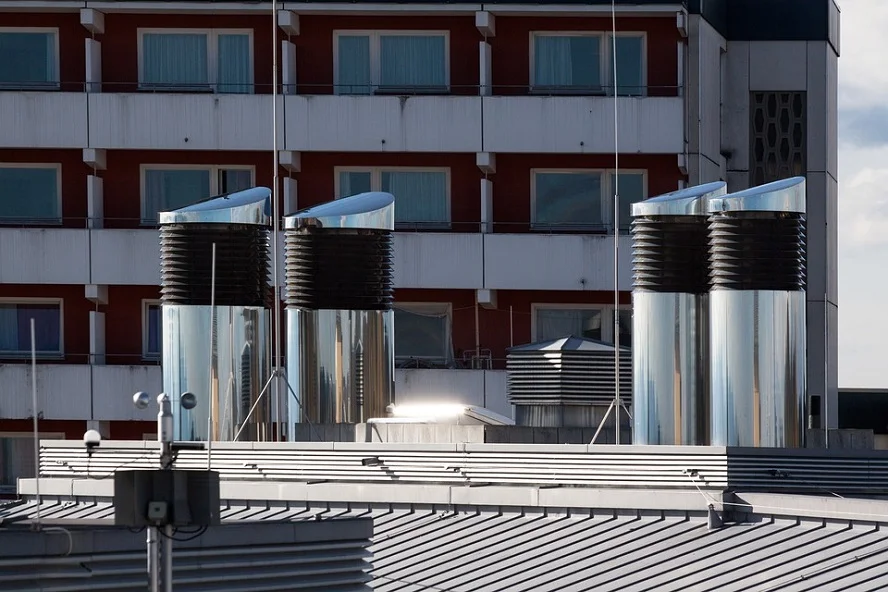 Well-maintained rooftop air ducts in a residential building.