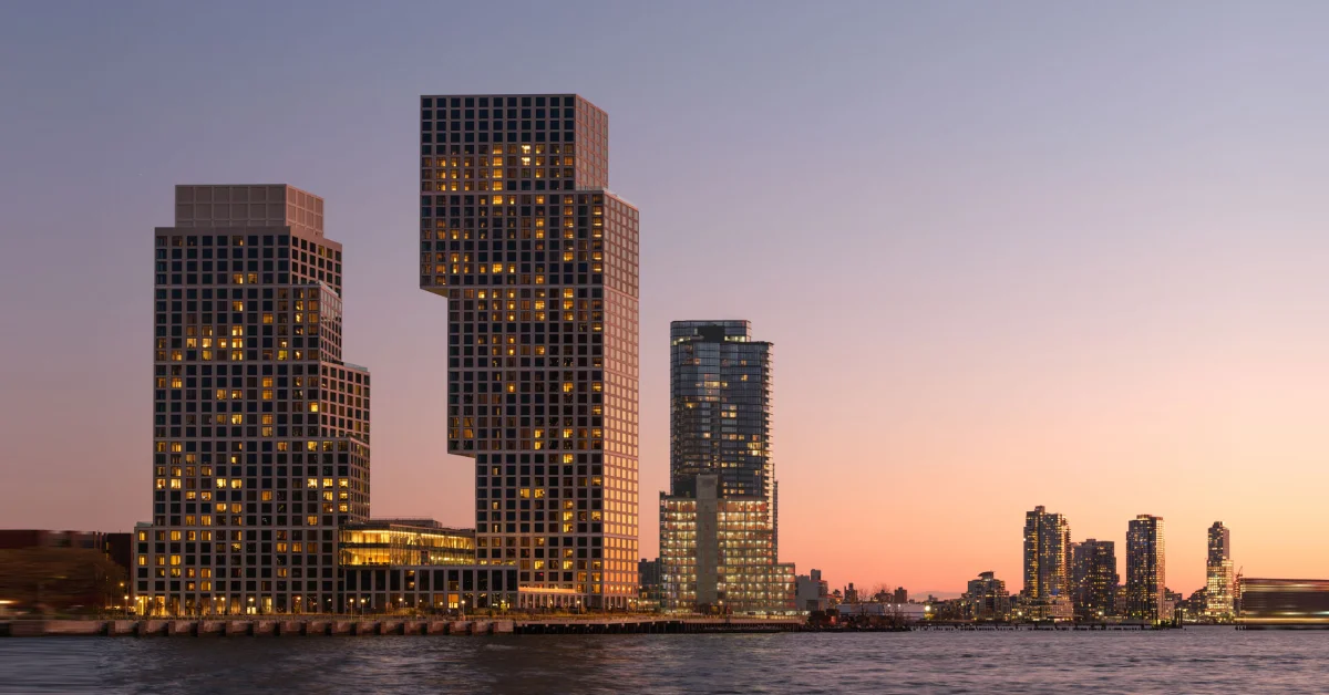 Aluminum Composite Panels: The Modern Building Material Transforming Architecture - Roofing - Homedecortoday Modern buildings with aluminum composite panel facades reflecting sunset light along waterfront skyline