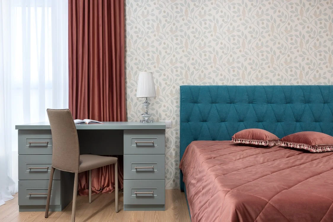 Modern bedroom interior with sleek furniture, cozy bedding, and soft lighting for a relaxing and stylish home retreat.


