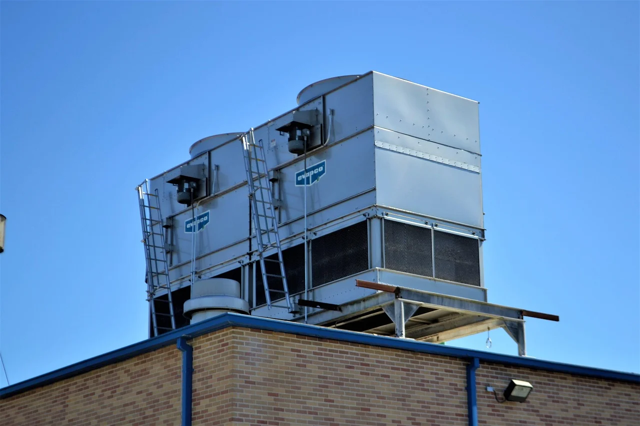 Commercial HVAC cooling towers on building roof for large-scale indoor air quality management
