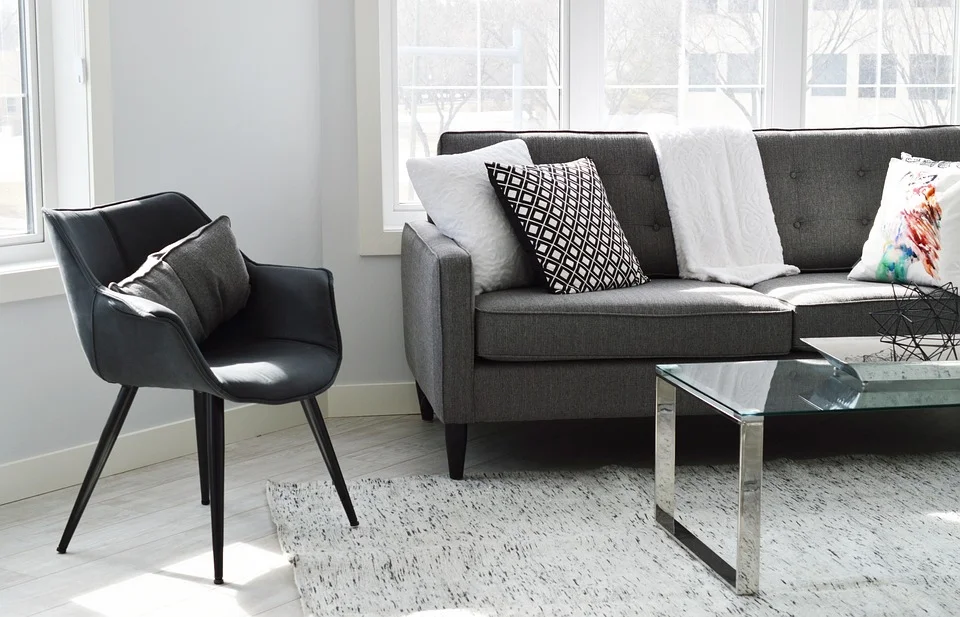 Modern living room with gray sofa, natural light, and minimalist design to transform your home