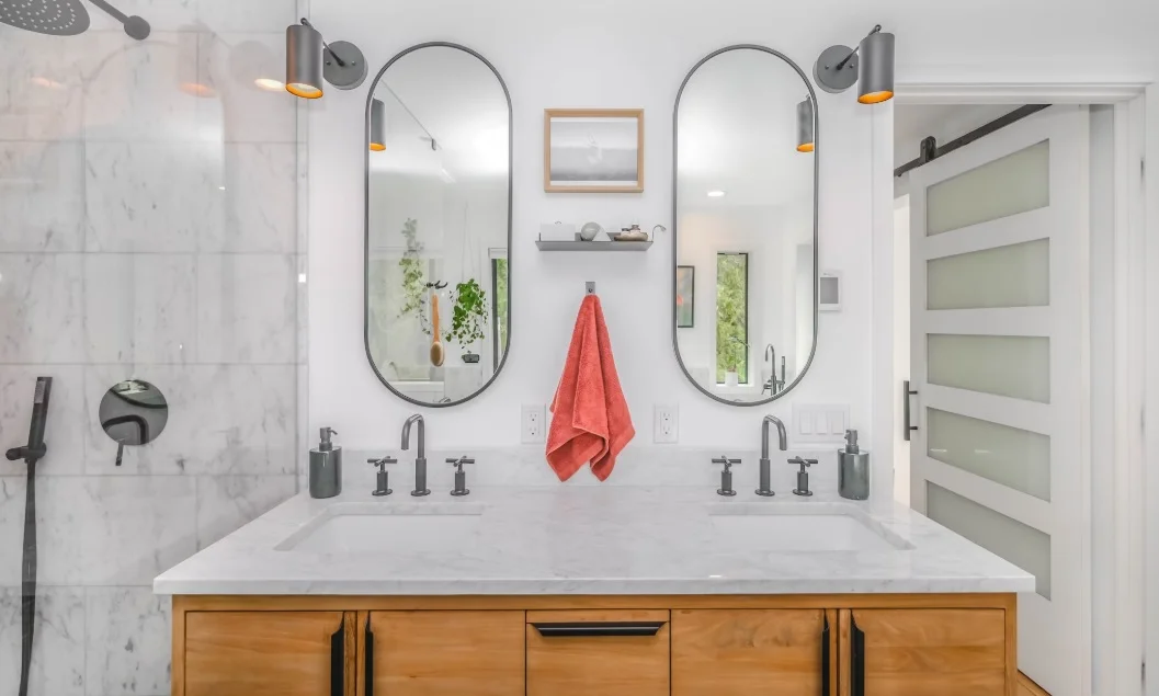 Bathroom remodel with white ceramic sink and wall mirror

