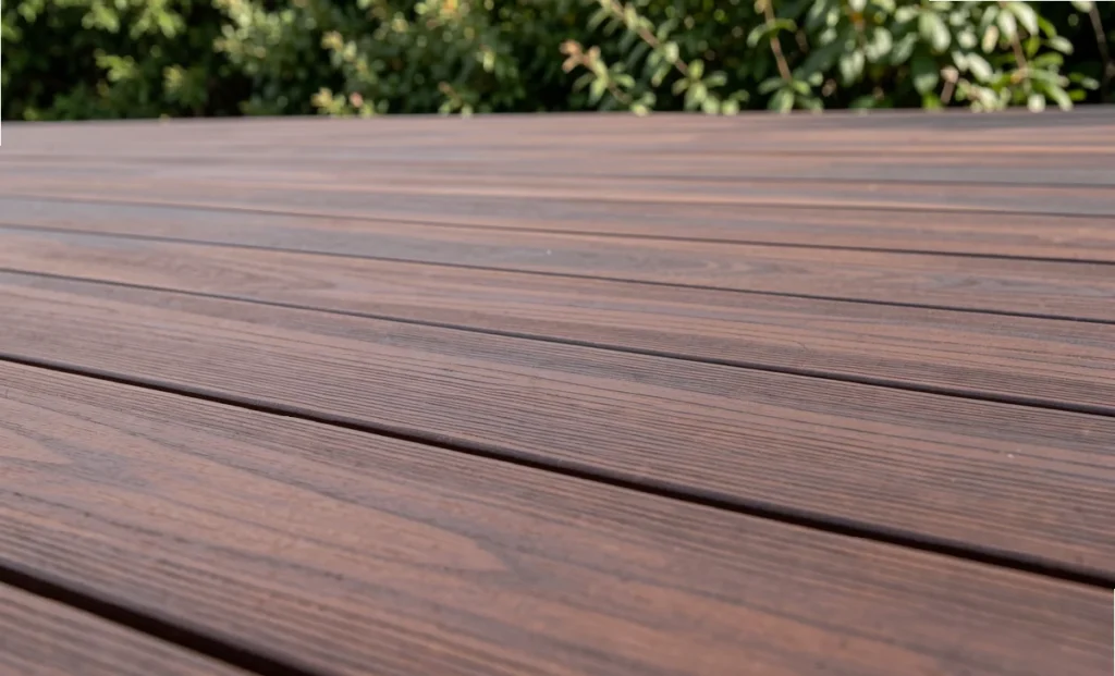 The Ultimate Guide to IPE Decking: Dimensions, Species and Where to Buy Close-up of IPE decking boards showing rich brown grain texture on an outdoor deck